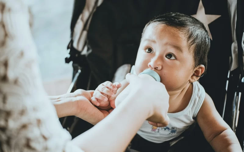 Baby feeding from bottle
