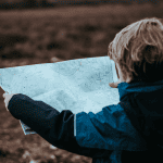 Child holding a map