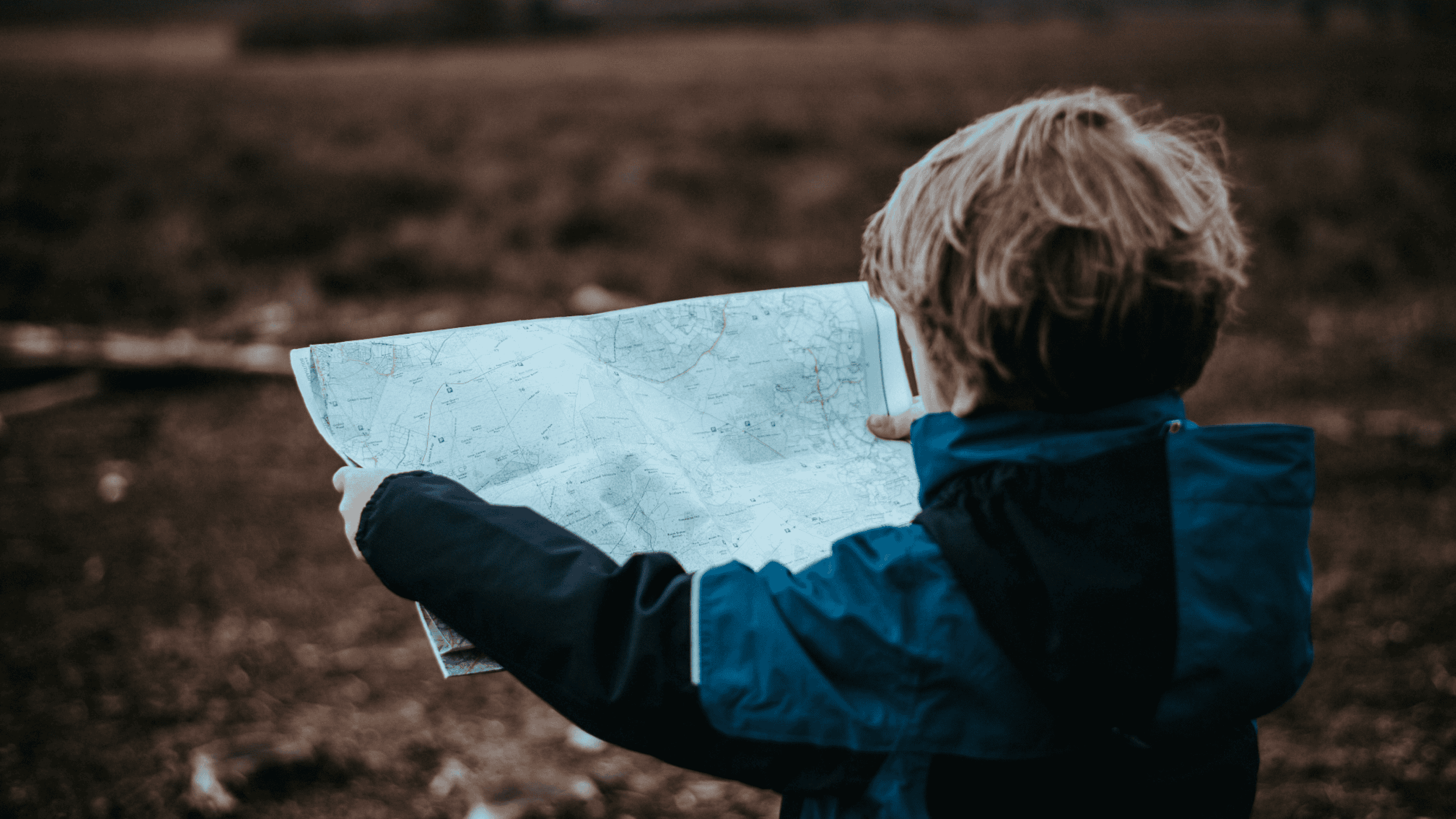Child holding a map